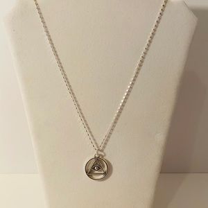 Silver plated Hasma evil eye necklace.